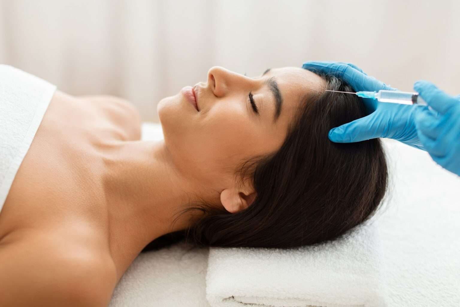 Specialist performing PRP scalp therapy for hair restoration
