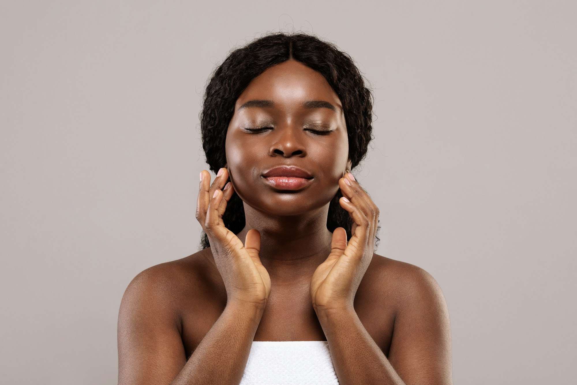 Woman with glowing even-toned skin after IPL photofacial