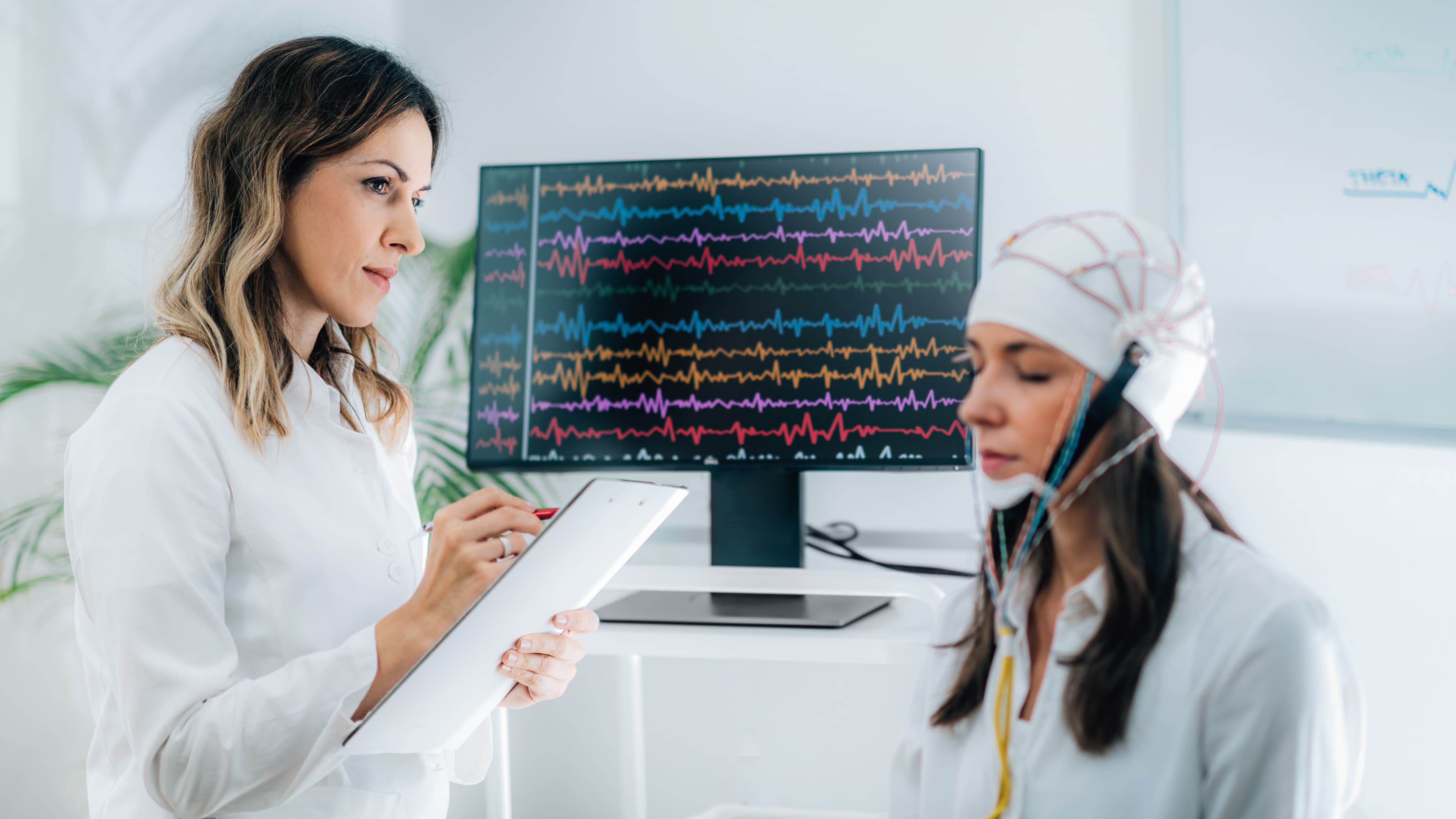 Patient undergoing EEG neurofeedback brain mapping session